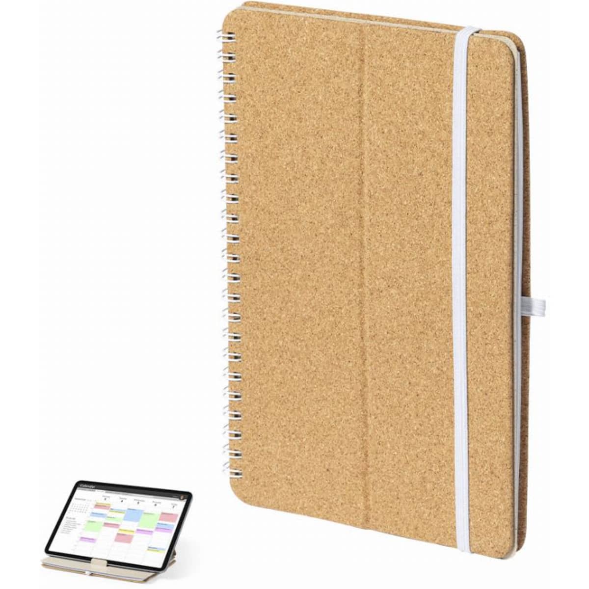 A cork-covered spiral notebook with a white elastic band, positioned next to a tablet.