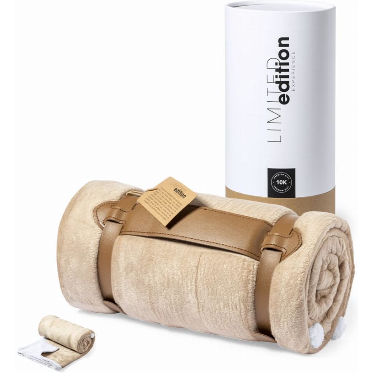 A rolled beige blanket secured with a brown strap, accompanied by a packaging tube and a small label.