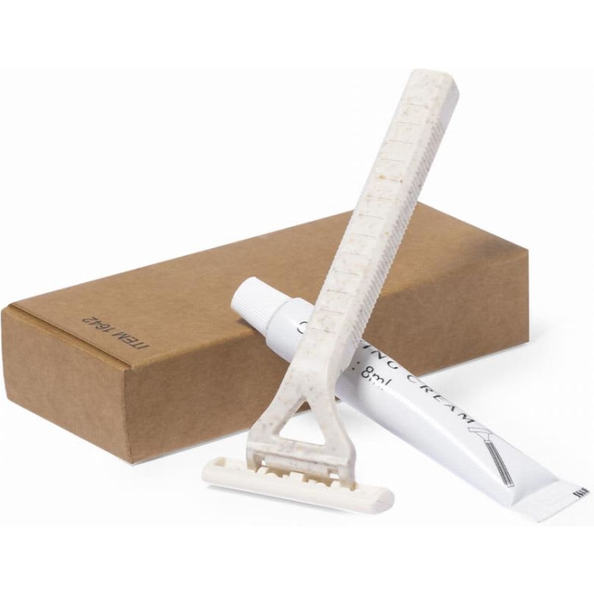 A shaving kit featuring a white razor, a tube of shaving cream, and a brown cardboard box.
