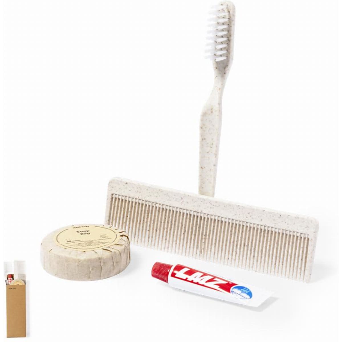 A comb, toothbrush, solid shampoo bar, and lip balm in a neutral colour, packaged together in a box.