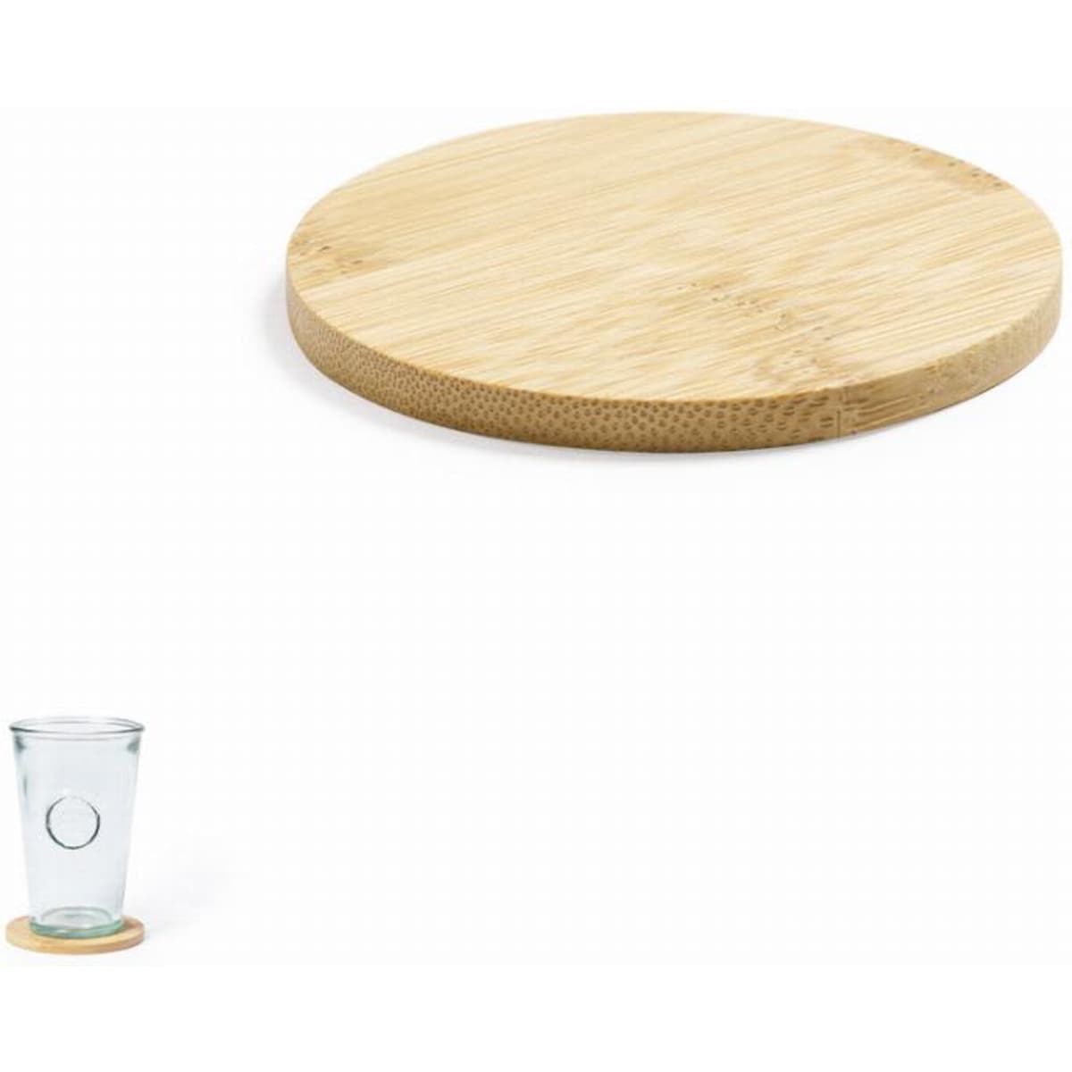 A round bamboo serving board with a smooth surface, accompanied by a clear glass cup on a bamboo coaster.