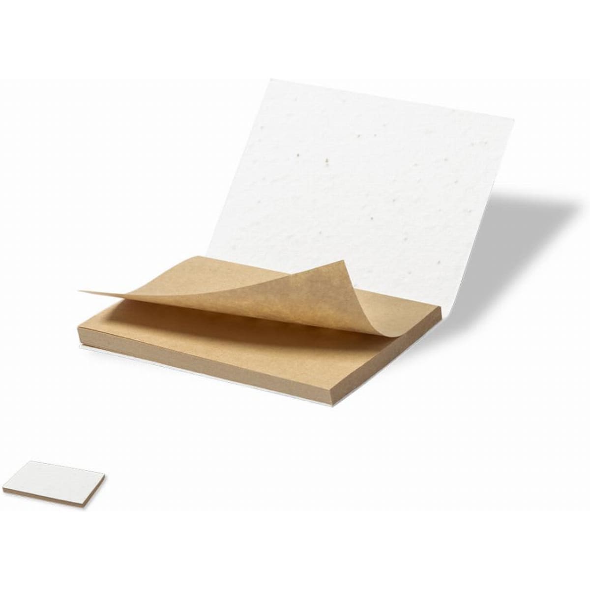 A stack of eco-friendly paper with a brown base and a sheet of handmade white paper partially lifted.