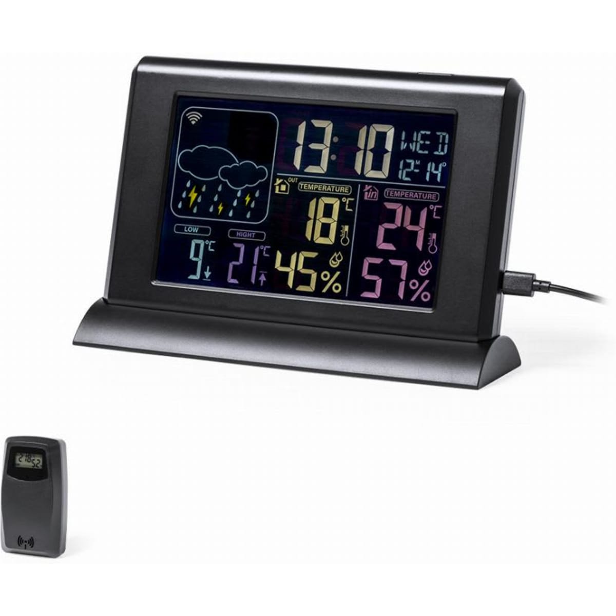 A digital weather station with a black frame displaying time, temperature, humidity, and weather icons. It includes a remote sensor.