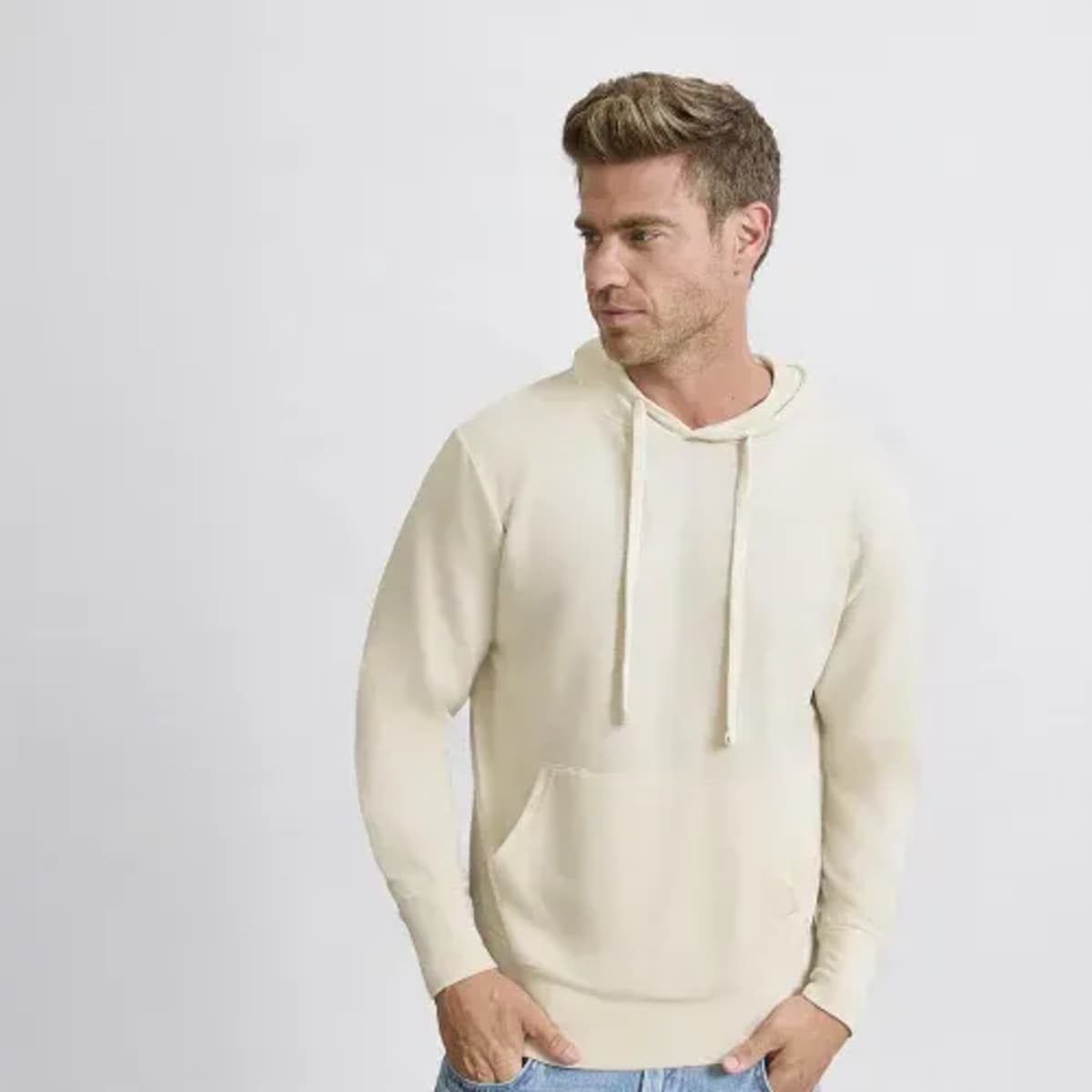 A beige hoodie with a front pocket and drawstrings, featuring a logo on the front.