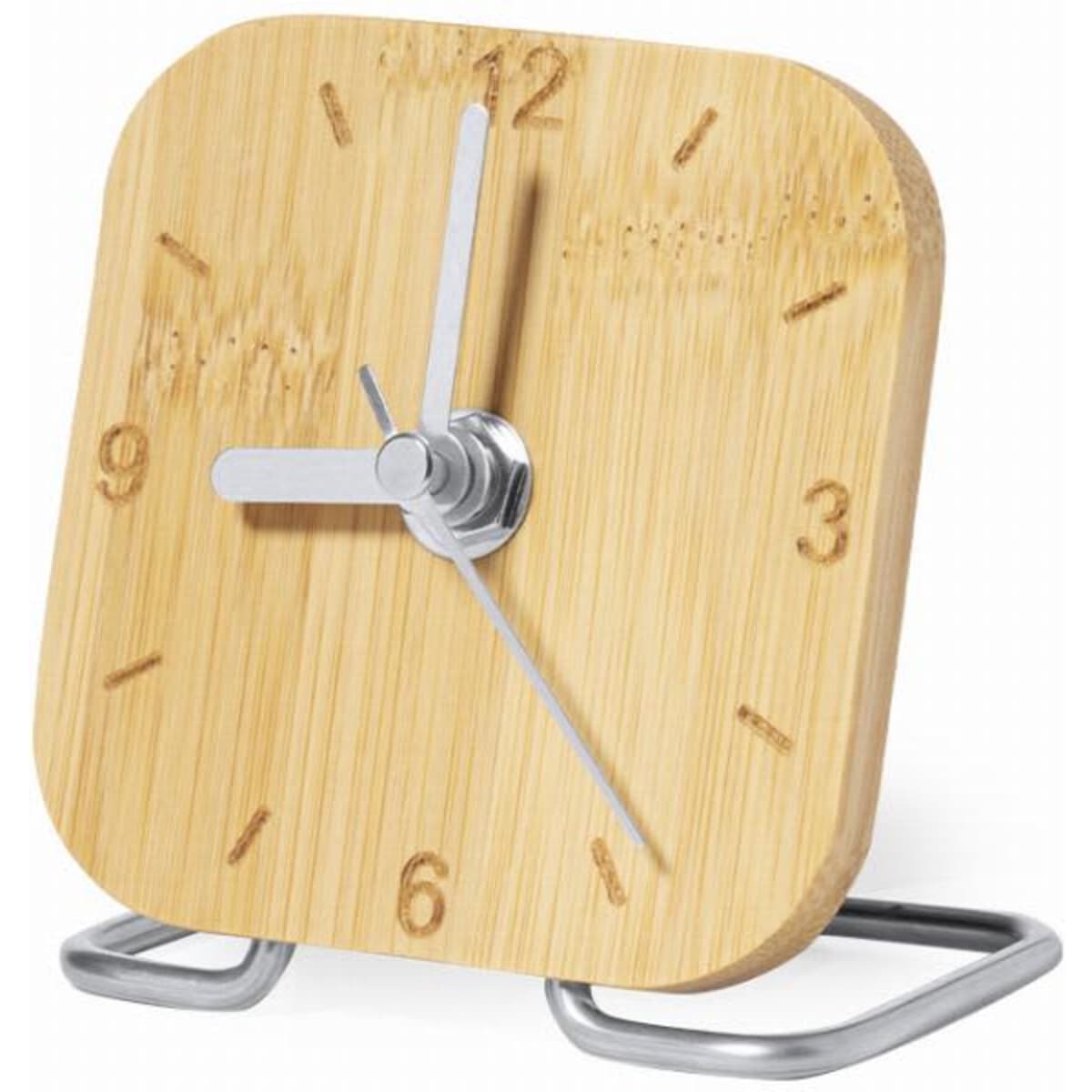 A desk clock with a square bamboo face, silver hands, and a metal stand. Natural wood finish.