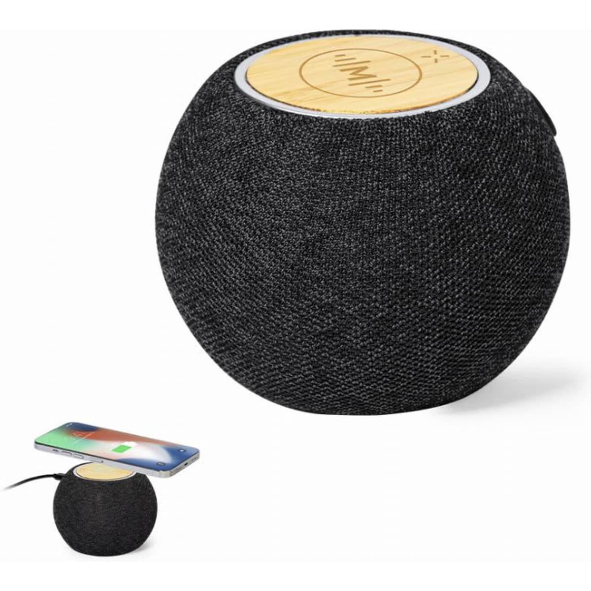 A speaker with a round, black fabric exterior and a wooden top, alongside a phone placed on it.