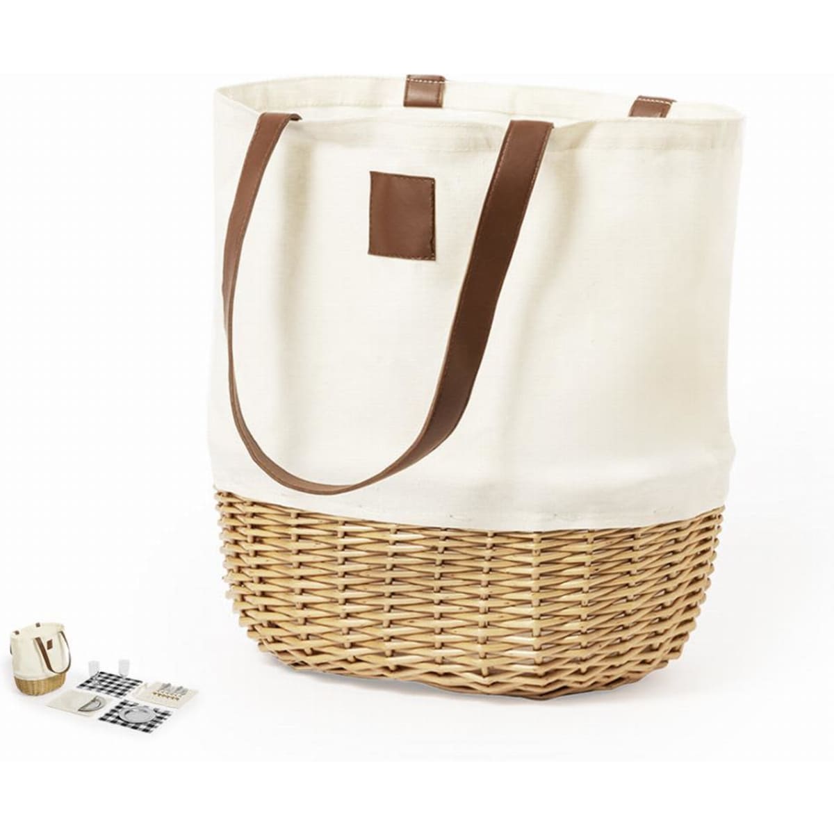 A tote bag with a cream canvas upper and woven wicker bottom, featuring brown leather handles.