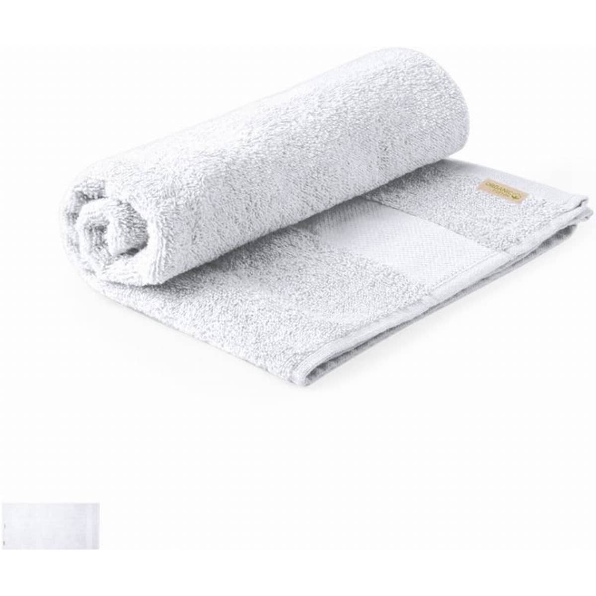 A rolled grey towel made of soft fabric, featuring a small logo on one side.