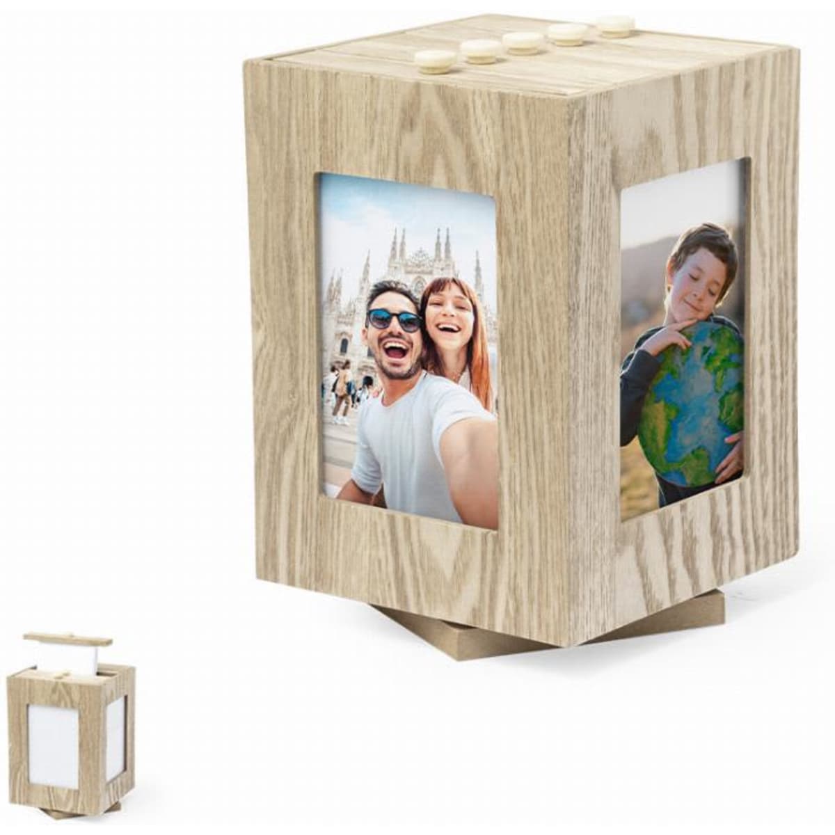 A wooden photo cube with two picture frames and a small lantern-like accessory. The wood has a light, natural finish.