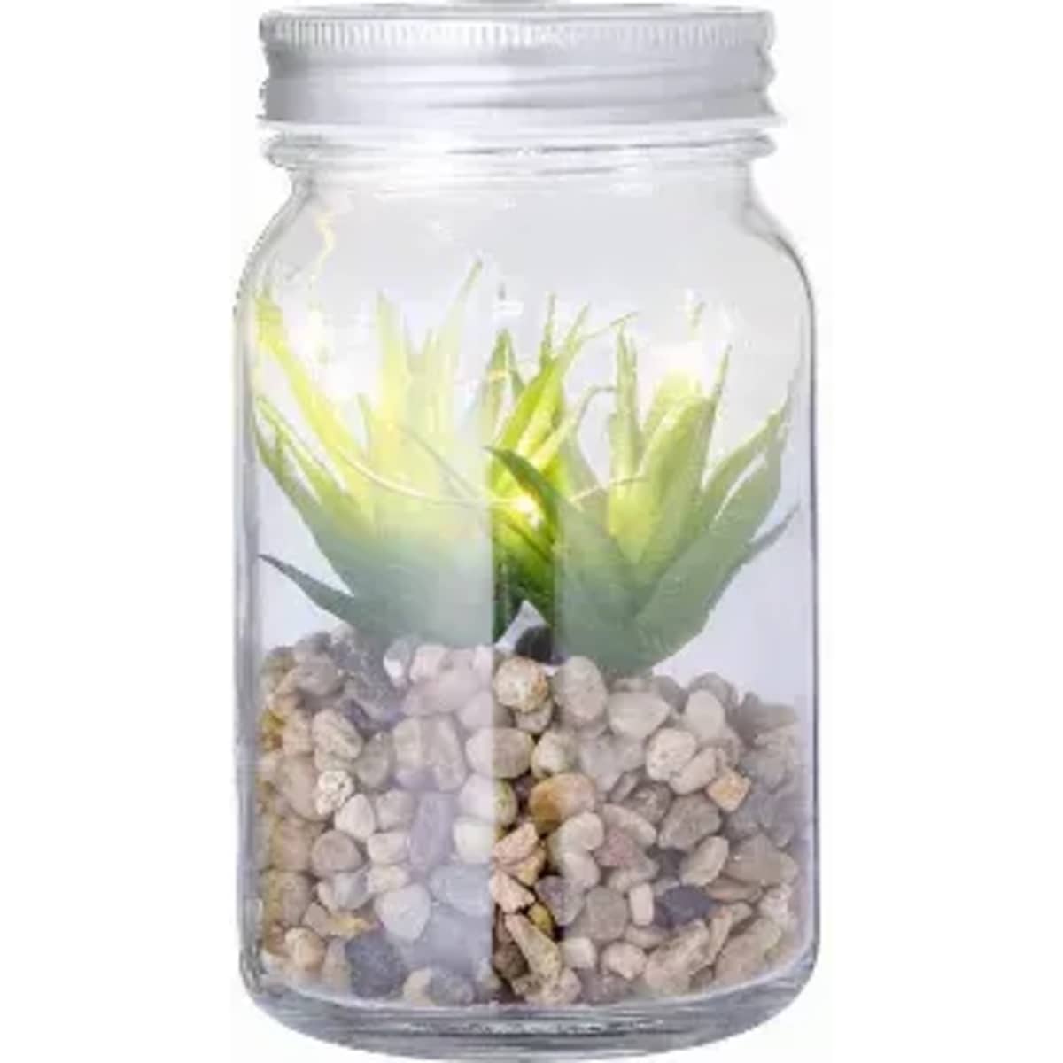 A glass jar containing a small artificial plant and pebbles, with a light source enhancing the greenery.