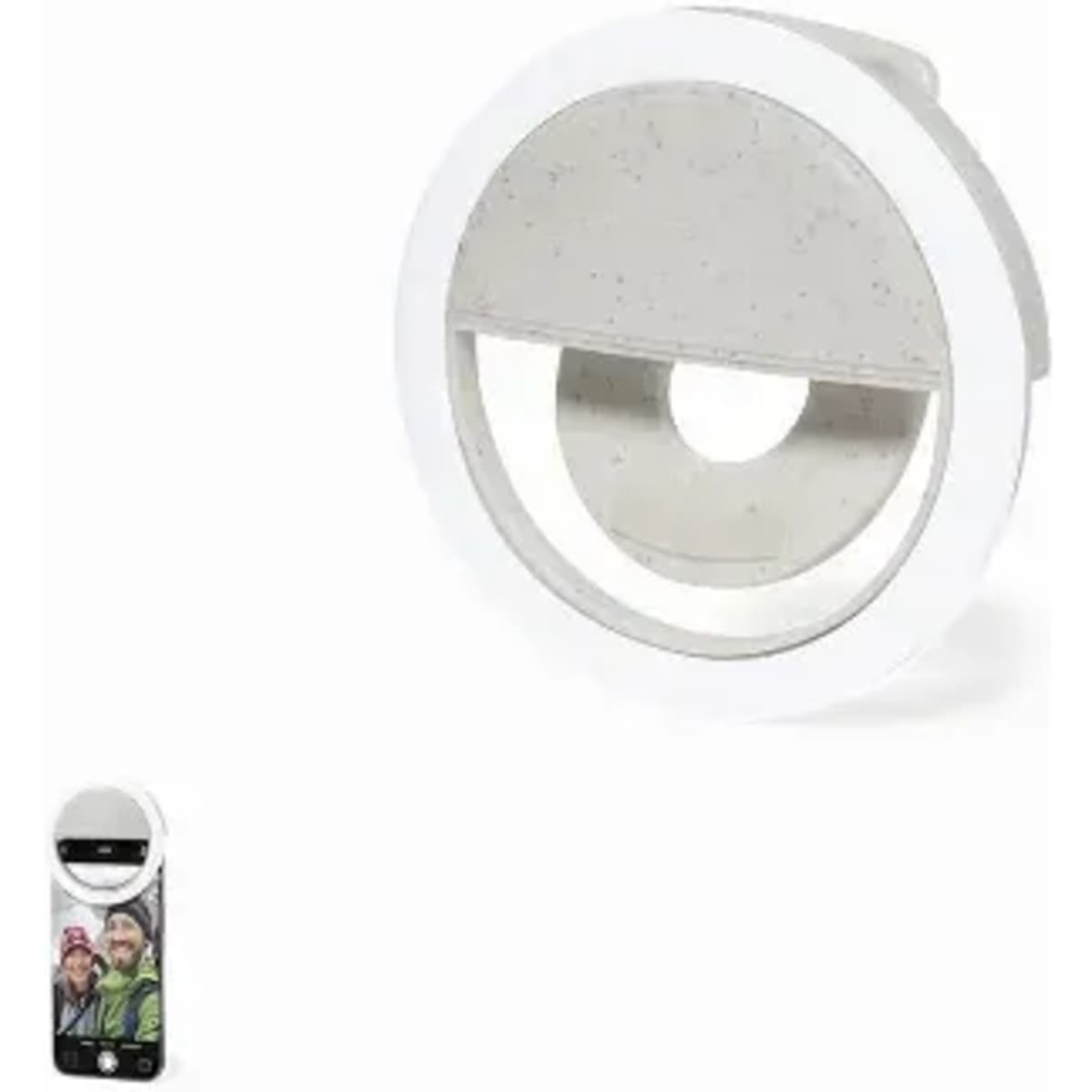 A circular phone holder in white with a grey centre, shown alongside a smartphone displaying a photo.