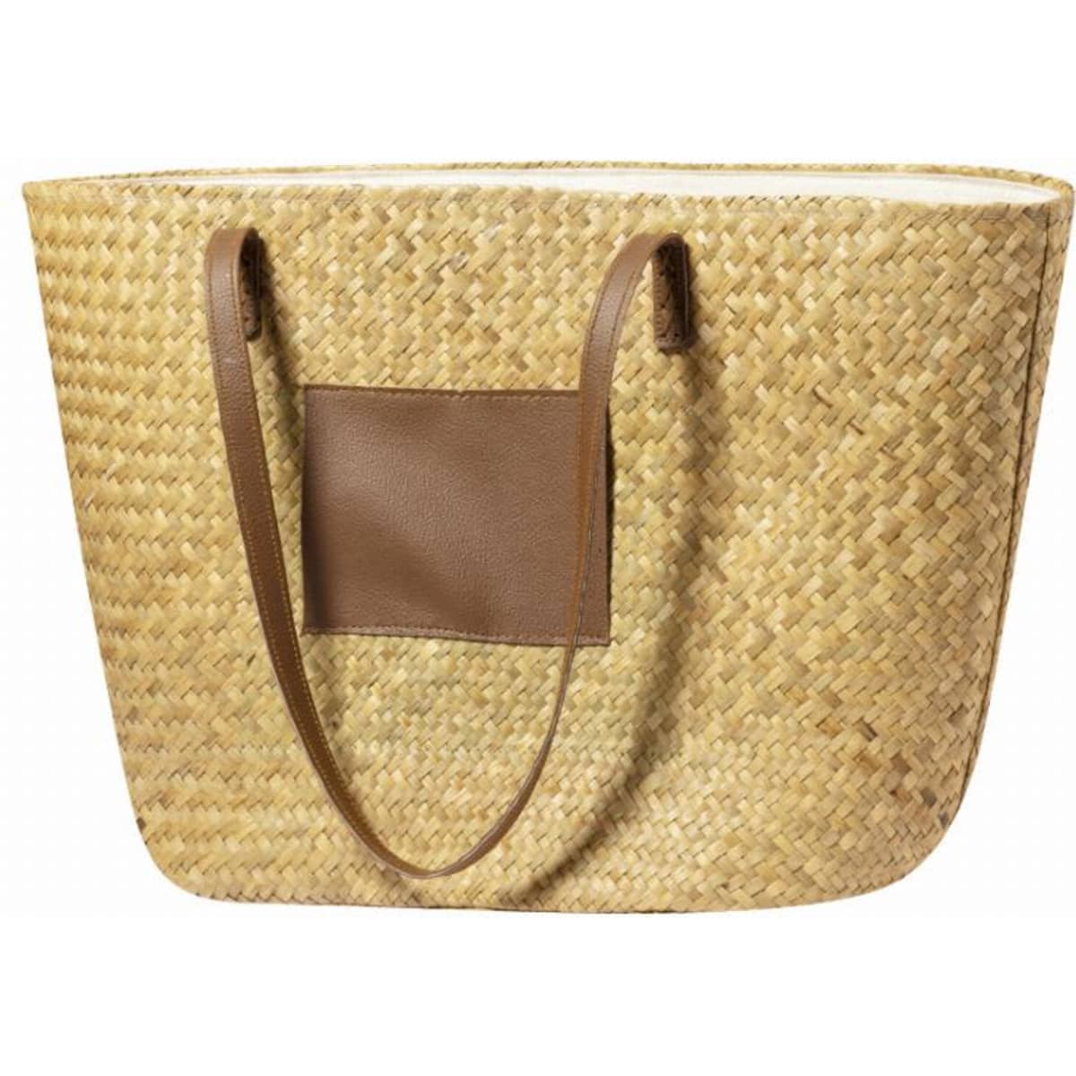 A straw tote bag with a brown leather handle and a side pocket, featuring a natural woven texture.
