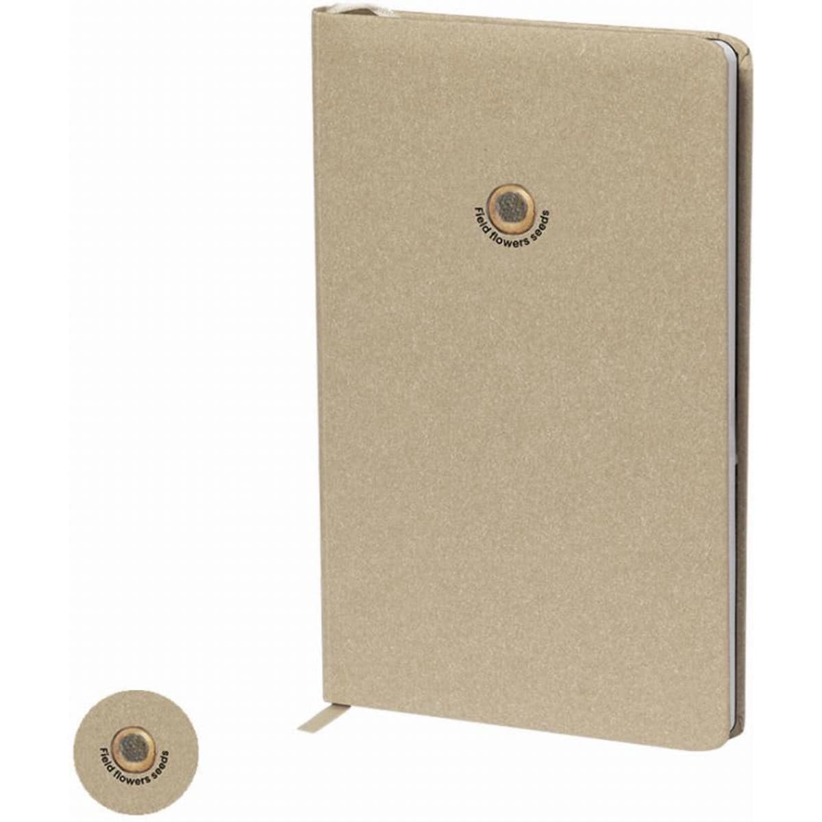 A notebook with a tan cover, featuring a circle logo on the front and a bookmark ribbon.