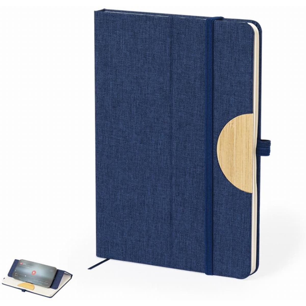 A navy blue notebook with a fabric cover and a circular wooden accent, secured with an elastic band.