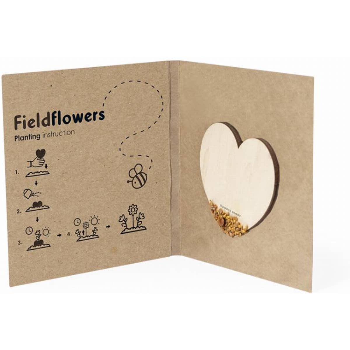 A folded kraft paper card featuring planting instructions for fieldflowers, with a heart-shaped cutout and seed contents.