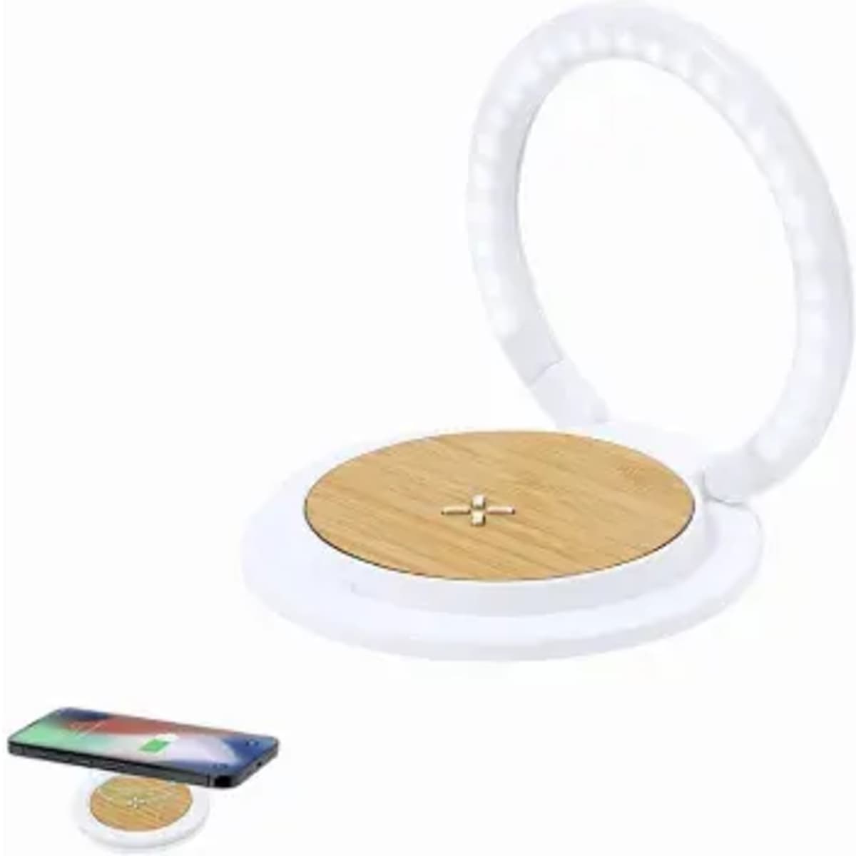 A wireless charging pad with a round bamboo surface and a circular white plastic frame, alongside a smartphone.