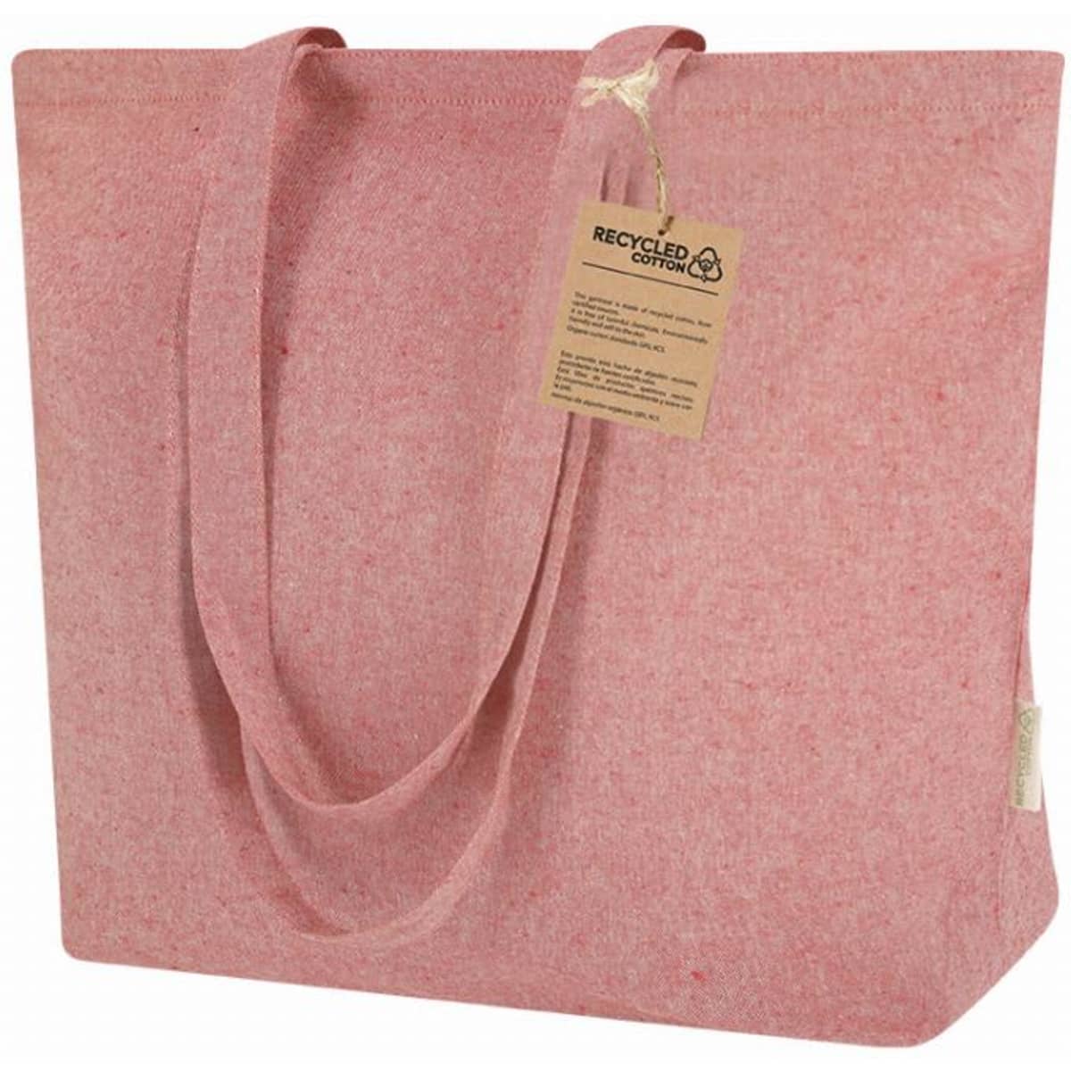 A pink tote bag made from recycled cotton, featuring two sturdy handles and a tag attached.