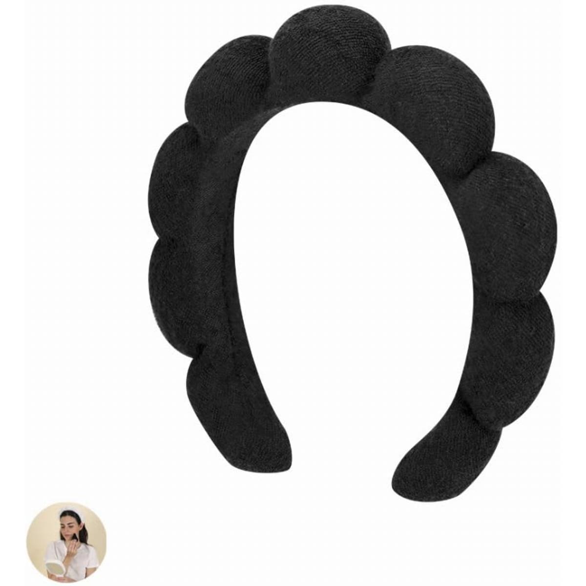 A black headband with a scalloped design, featuring a smooth texture and a simple, elegant style.