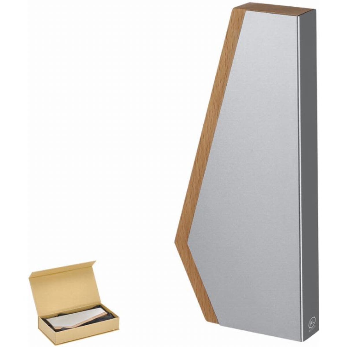 A geometric trophy in silver and wood finish, displayed next to a decorative box.