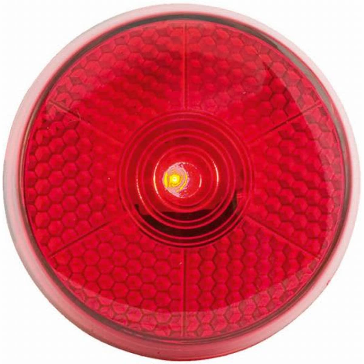 A round red light with a honeycomb pattern, featuring a central bulb. It has a clear outer casing.