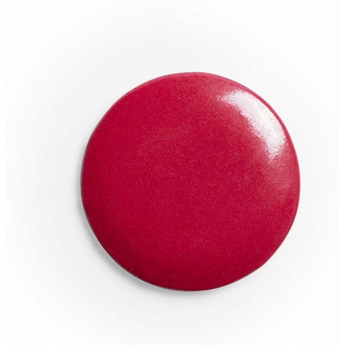 A circular, shiny red disc with a smooth surface, featuring a glossy finish.