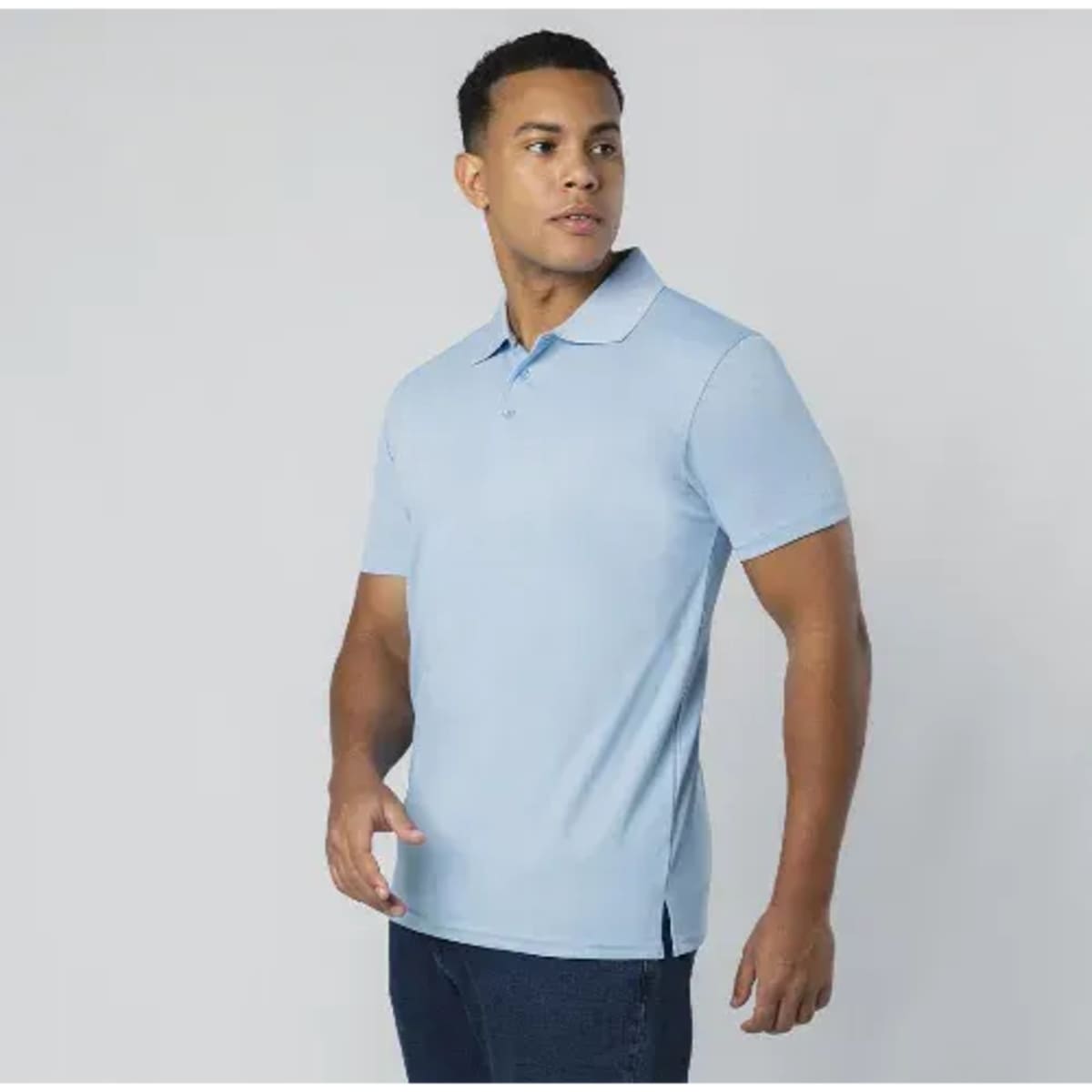 A light blue polo shirt with a logo, featuring a classic collar and short sleeves.