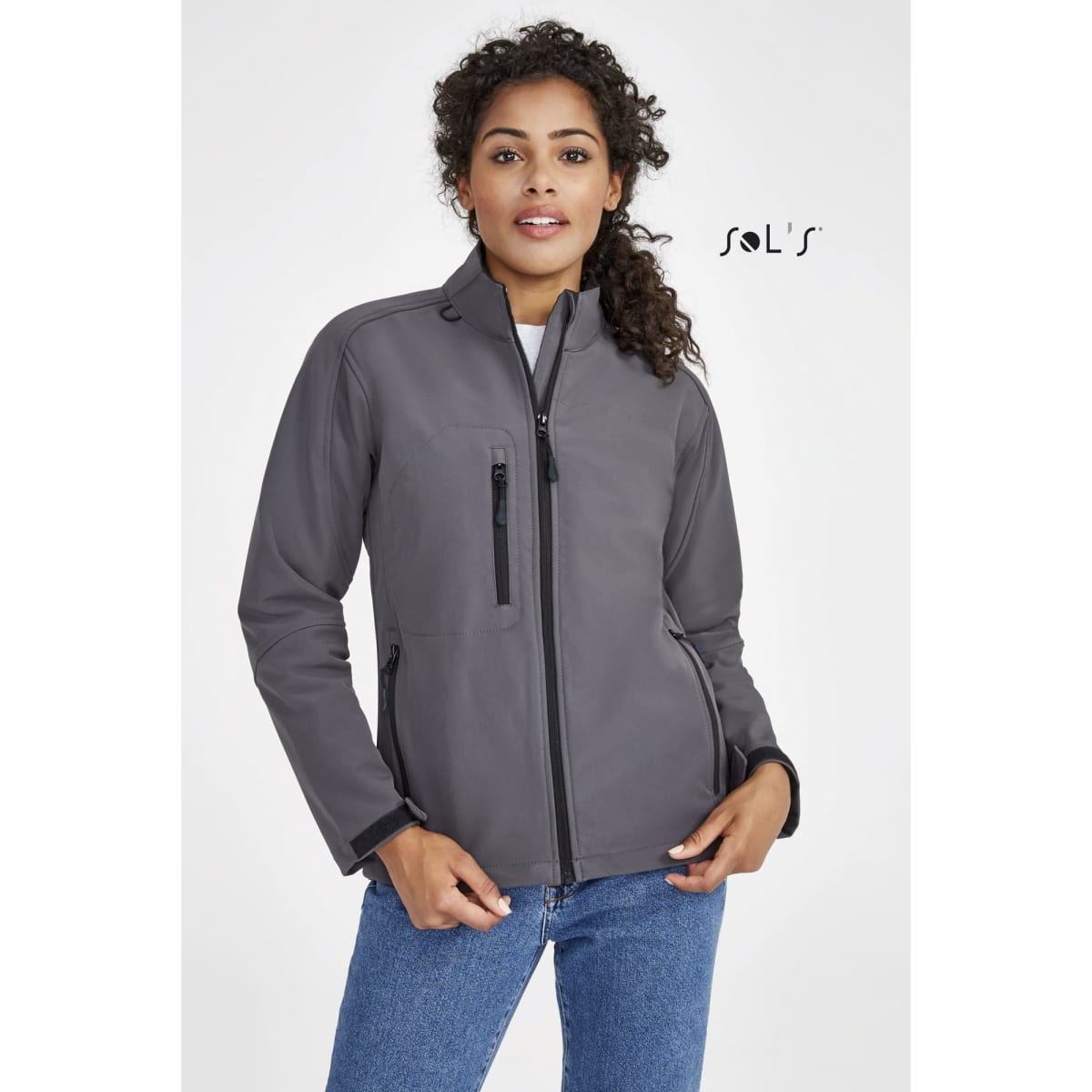 A women’s softshell jacket in grey with a zippered front and a branded logo.