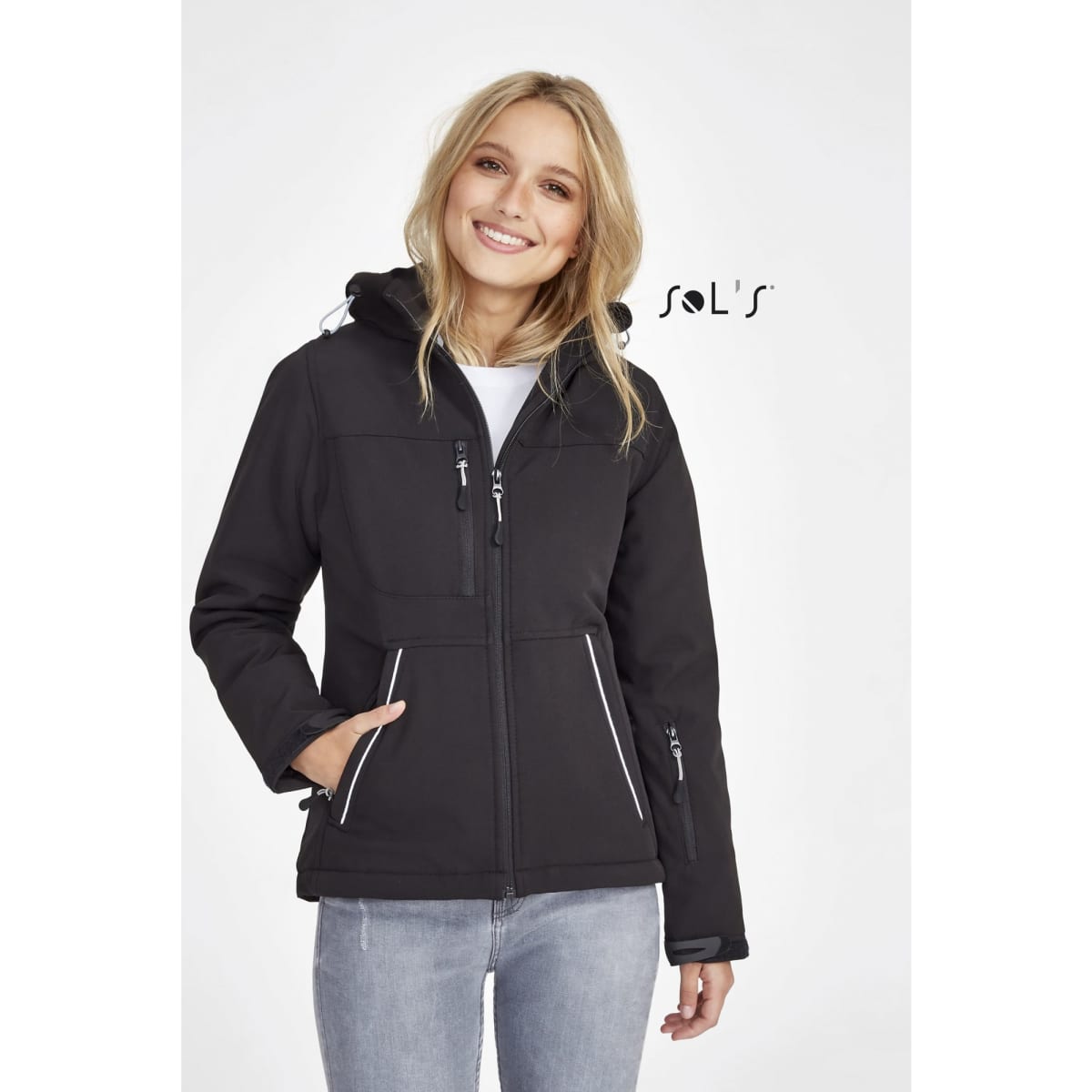 A women's black softshell jacket featuring a hood, zippers, and a logo, designed to be waterproof and breathable.