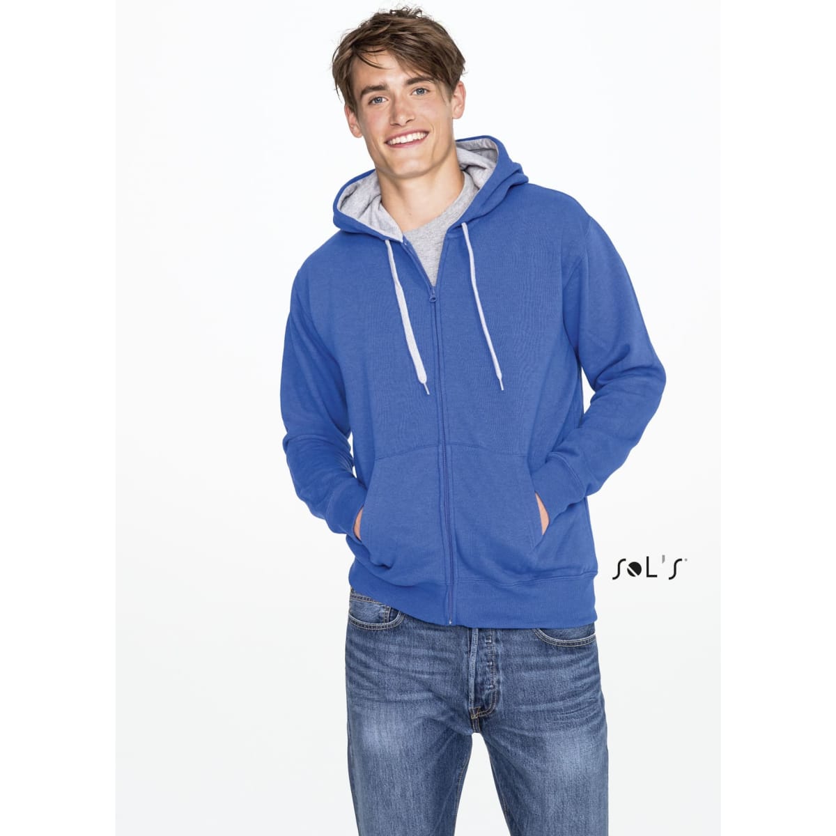 A blue hoodie featuring a brushed fleece lining, hidden zip, and a logo. Styled with a casual grey top and jeans.