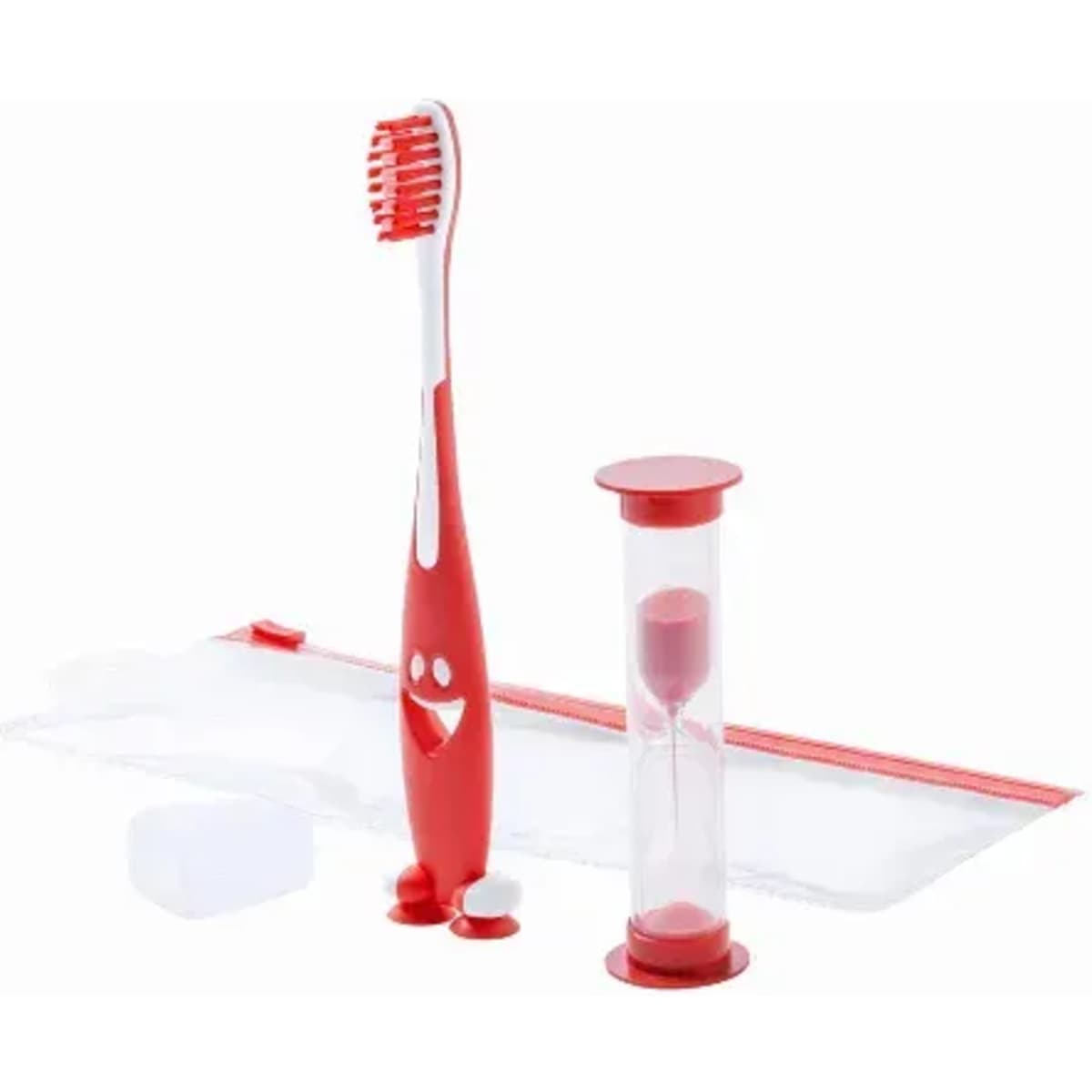 A red toothbrush with a smiling face design, an hourglass timer, and toothpaste tablets in a clear pouch.