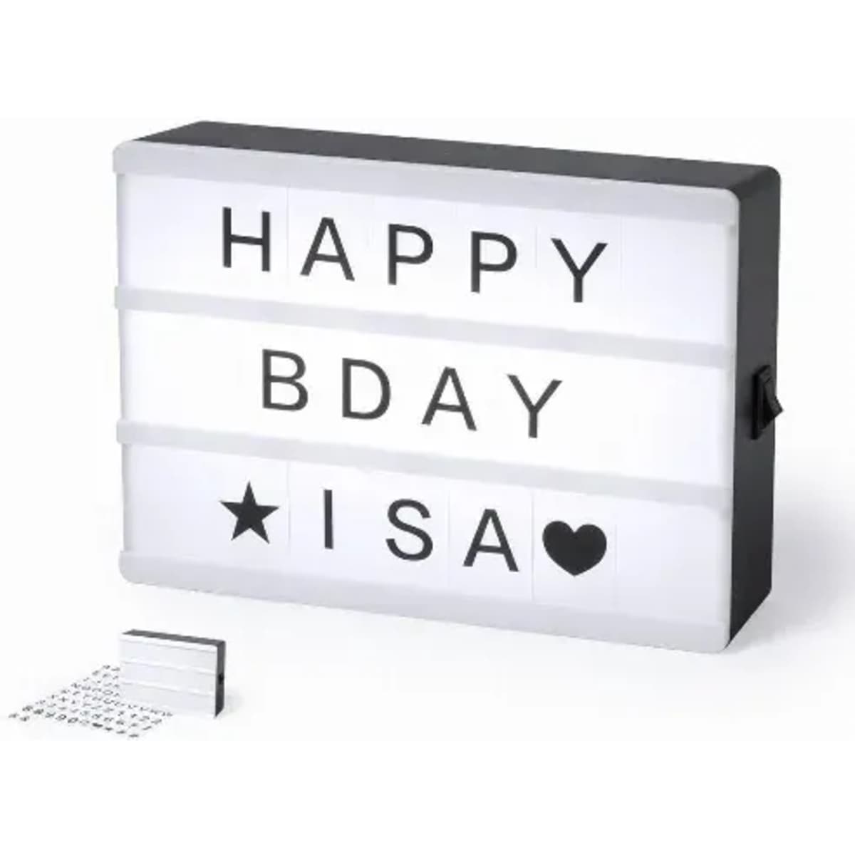 A lightbox with a black frame displaying black letters on a white background, featuring a star and heart symbol.
