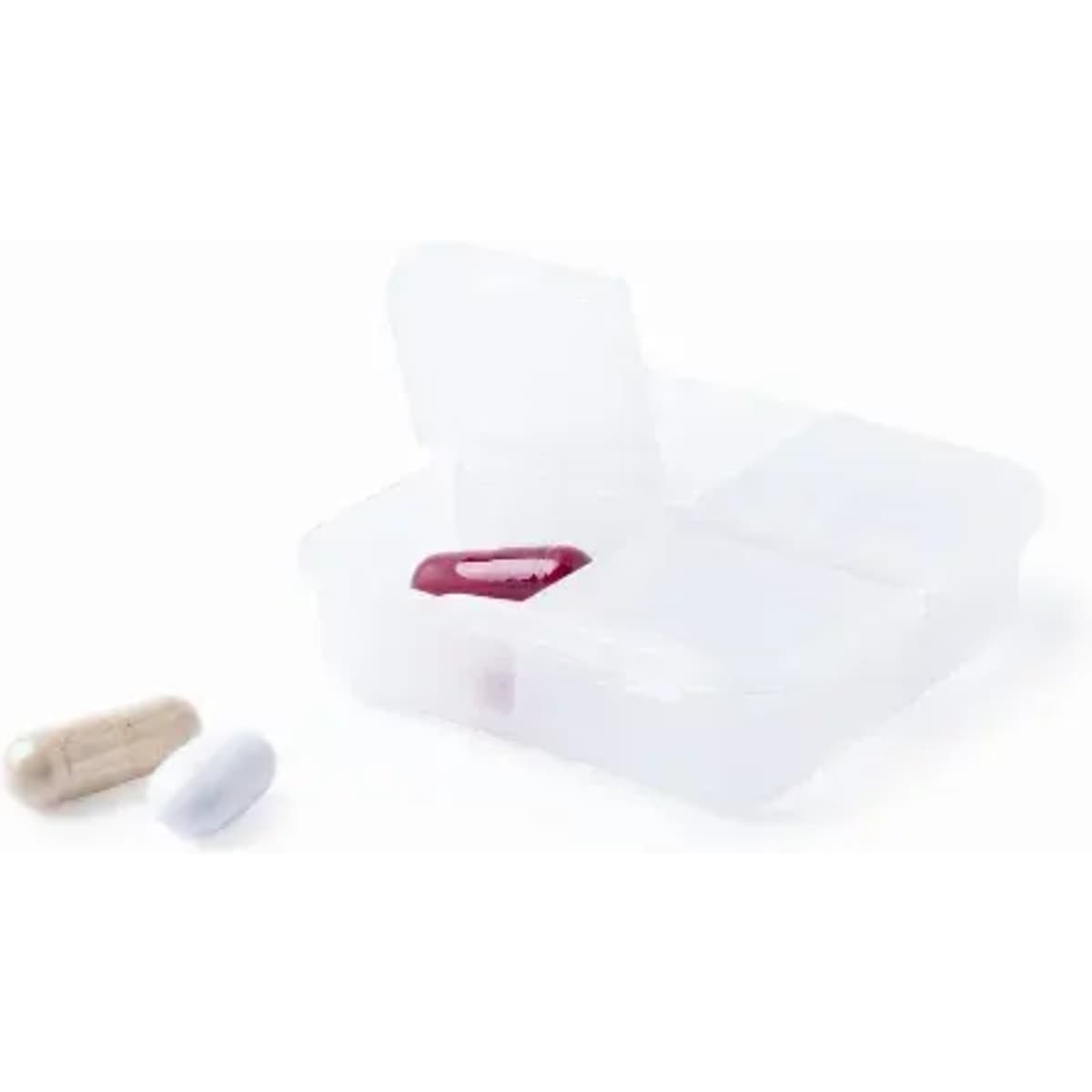 A pill organiser with four compartments, featuring three capsules in various colours: white, beige, and red.