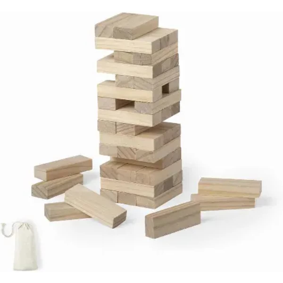 A wooden stacking game with rectangular blocks stacked in a tower and loose blocks surrounding it, along with a storage bag.