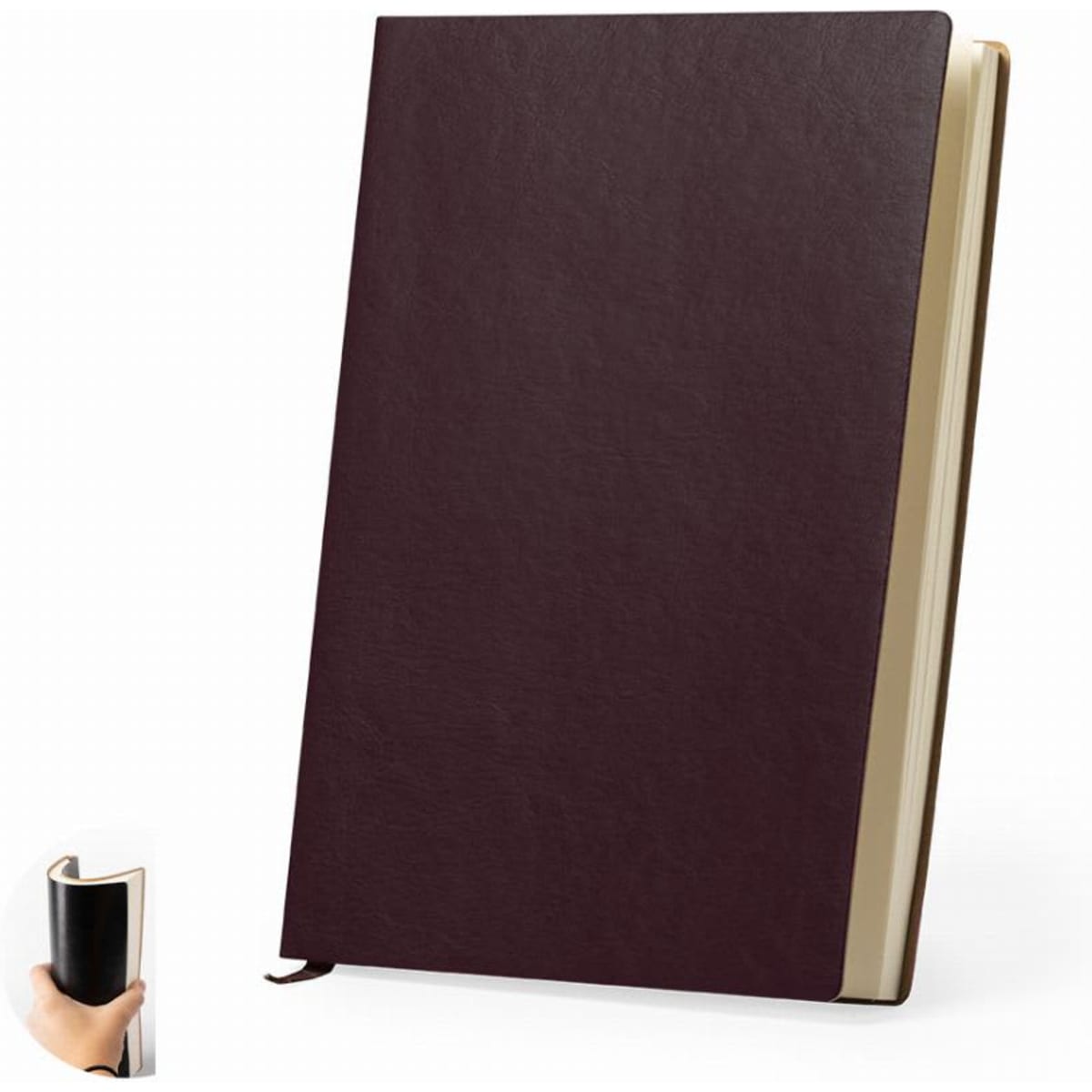 A burgundy notebook with a textured cover, featuring a ribbon marker and cream-coloured pages.
