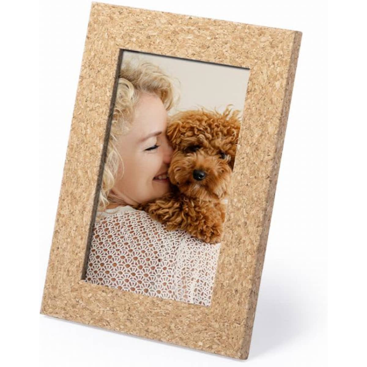 A photo frame featuring a cork texture, displaying an image of a woman and a small brown dog.