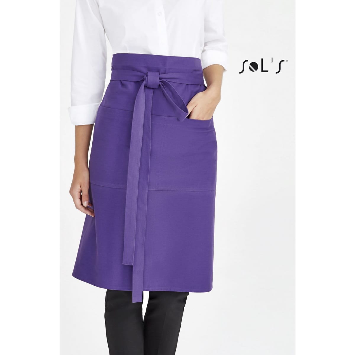 A purple waist apron with pockets, featuring a tied waist and worn by a model in a white shirt.