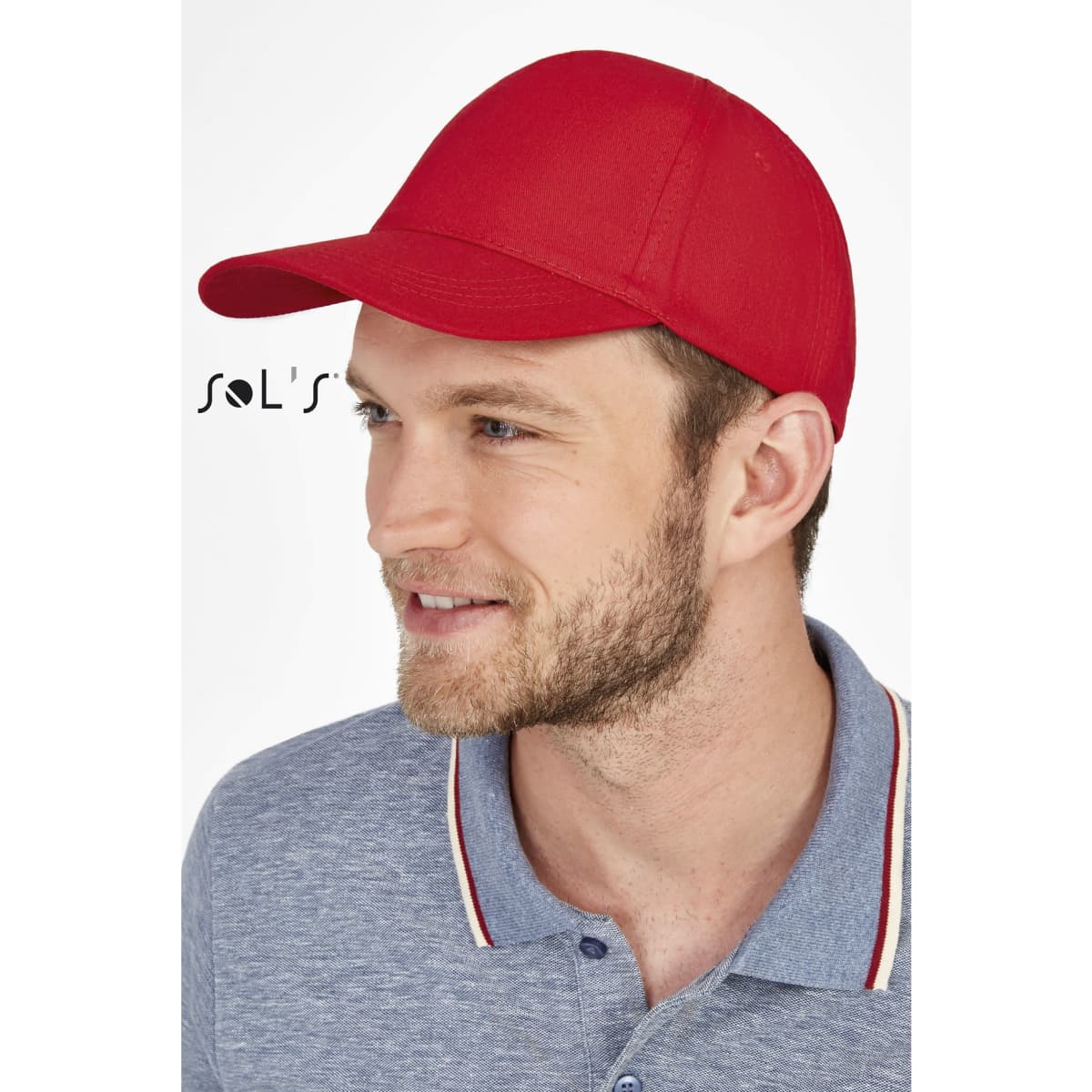 A red five-panel cap worn by a man, featuring a curved brim and a branding logo.