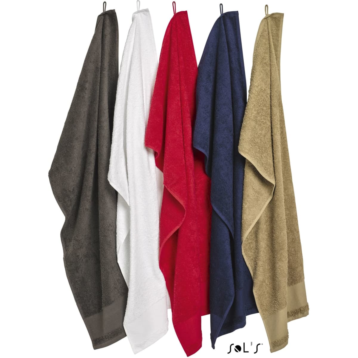 A collection of five bath towels in dark grey, white, red, navy, and beige, each hanging on a hook. Each towel has a logo.