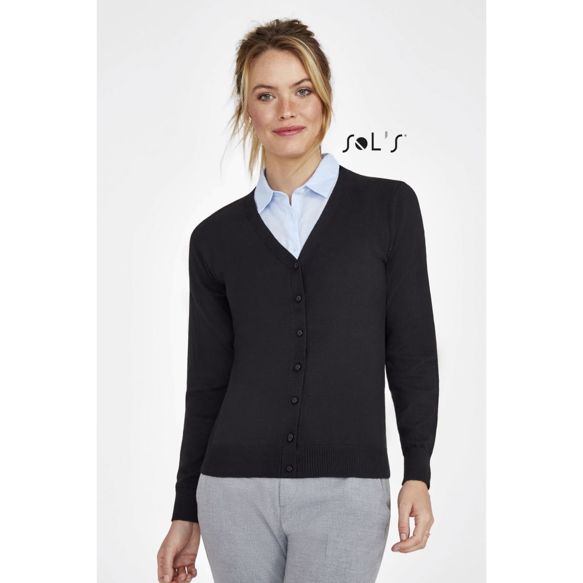 A women's black knitted cardigan with a V-neck and button closure, paired with a light blue shirt. It features a logo.