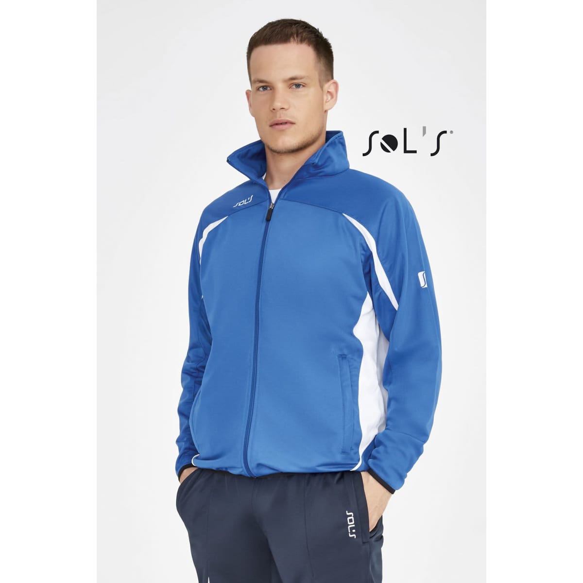 A blue and white tracksuit jacket with a zip-up front and stand-up collar, featuring a branding logo.