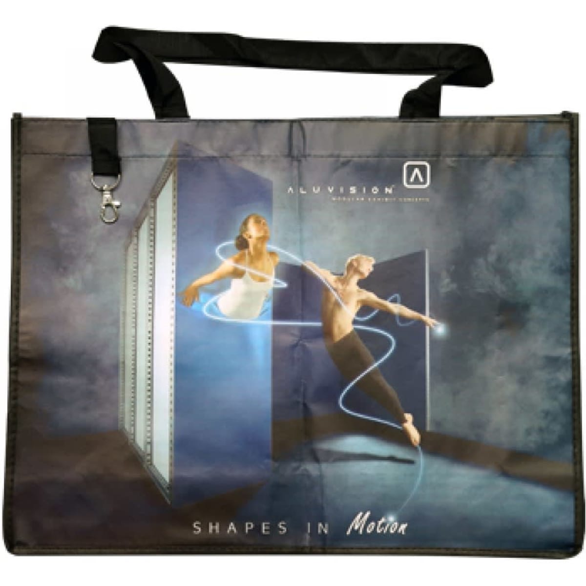 A large, black promotional bag featuring a striking graphic of two dancers in motion and a logo.