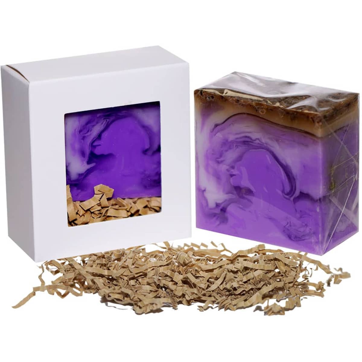 A boxed lavender soap with a purple and white marbled design, accompanied by crinkle paper filler.