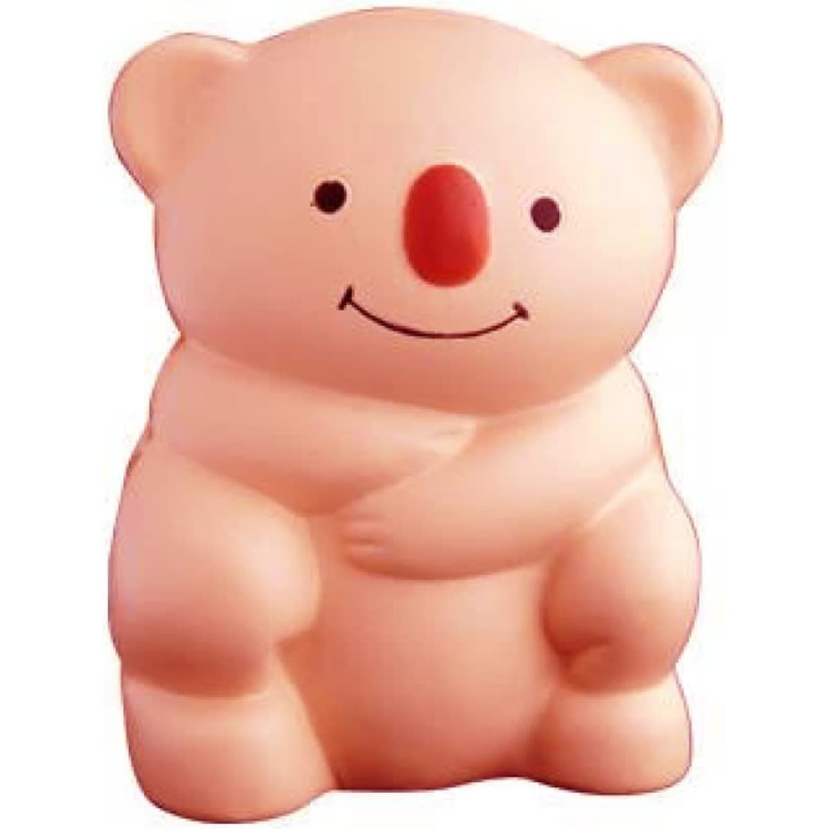 A stress relief toy in the shape of a koala, coloured light pink with a red nose and smiling face.