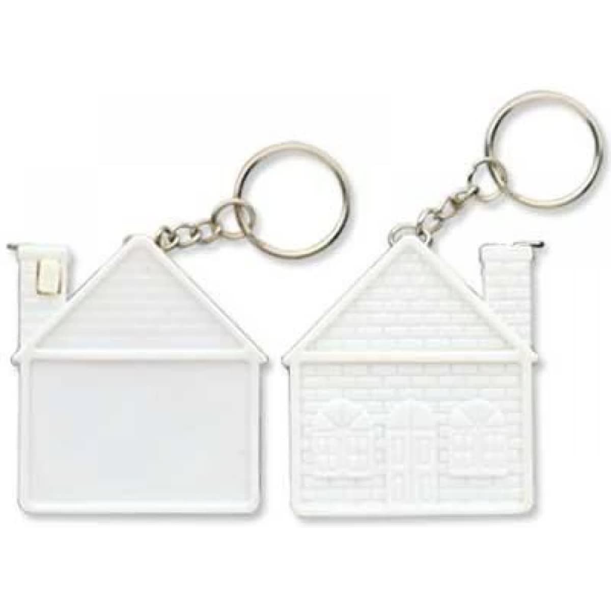 A white keychain shaped like a house, featuring a chimney and a textured side with windows and door details.