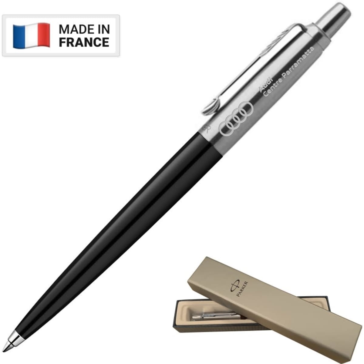 A metal ballpoint pen in black with a polished silver clip, presented in a beige box, featuring a logo.