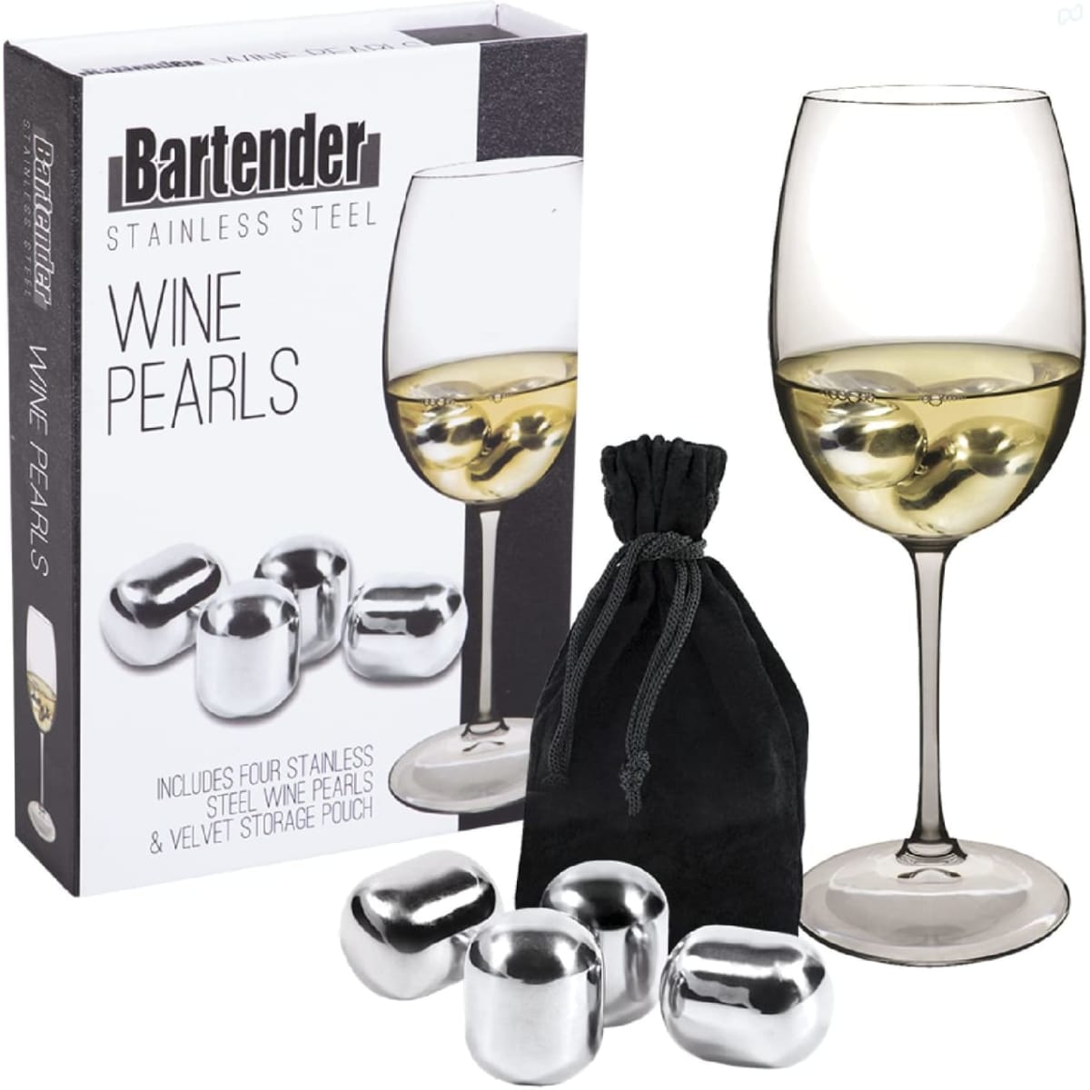 A set of four stainless steel wine pearls in a velvet pouch, displayed alongside a glass of white wine.