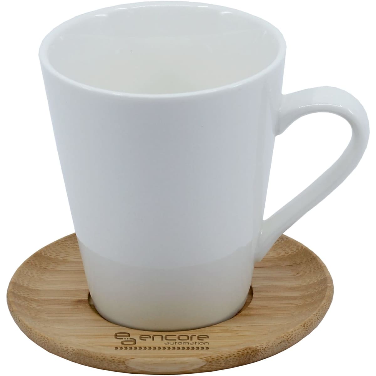 A white coffee mug sits on a round bamboo saucer. The mug features a sleek design with a handle.