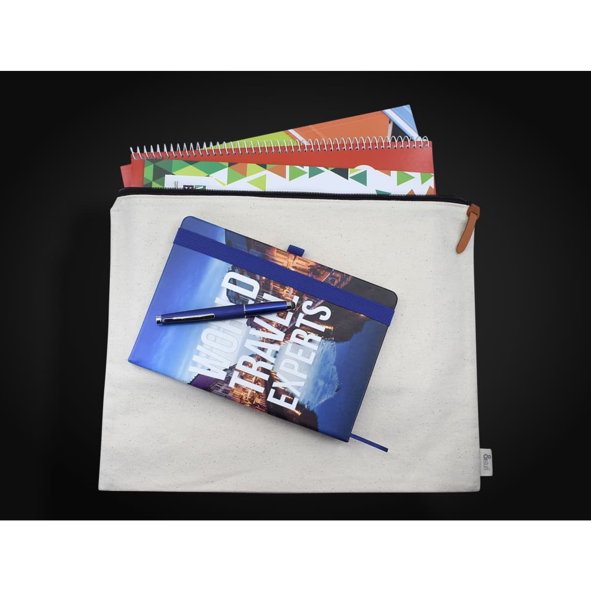 A cream conference bag with a zipper, featuring a notebook on top and several notepads peeking out.