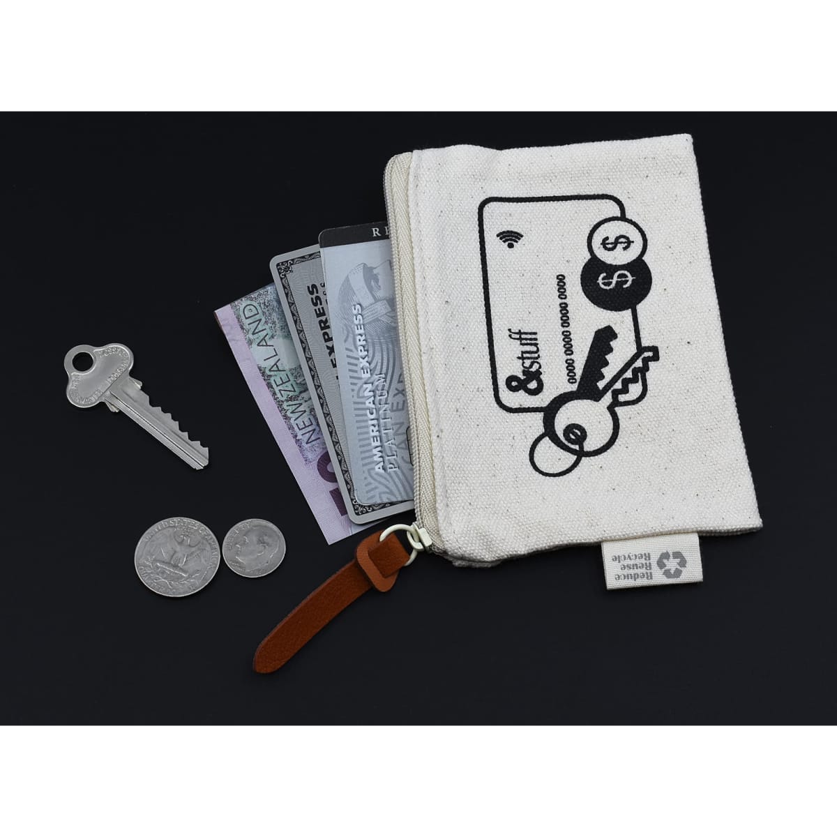 A small cream pouch with a key, coins, and cards partially visible inside, featuring a simple graphic design and a logo.