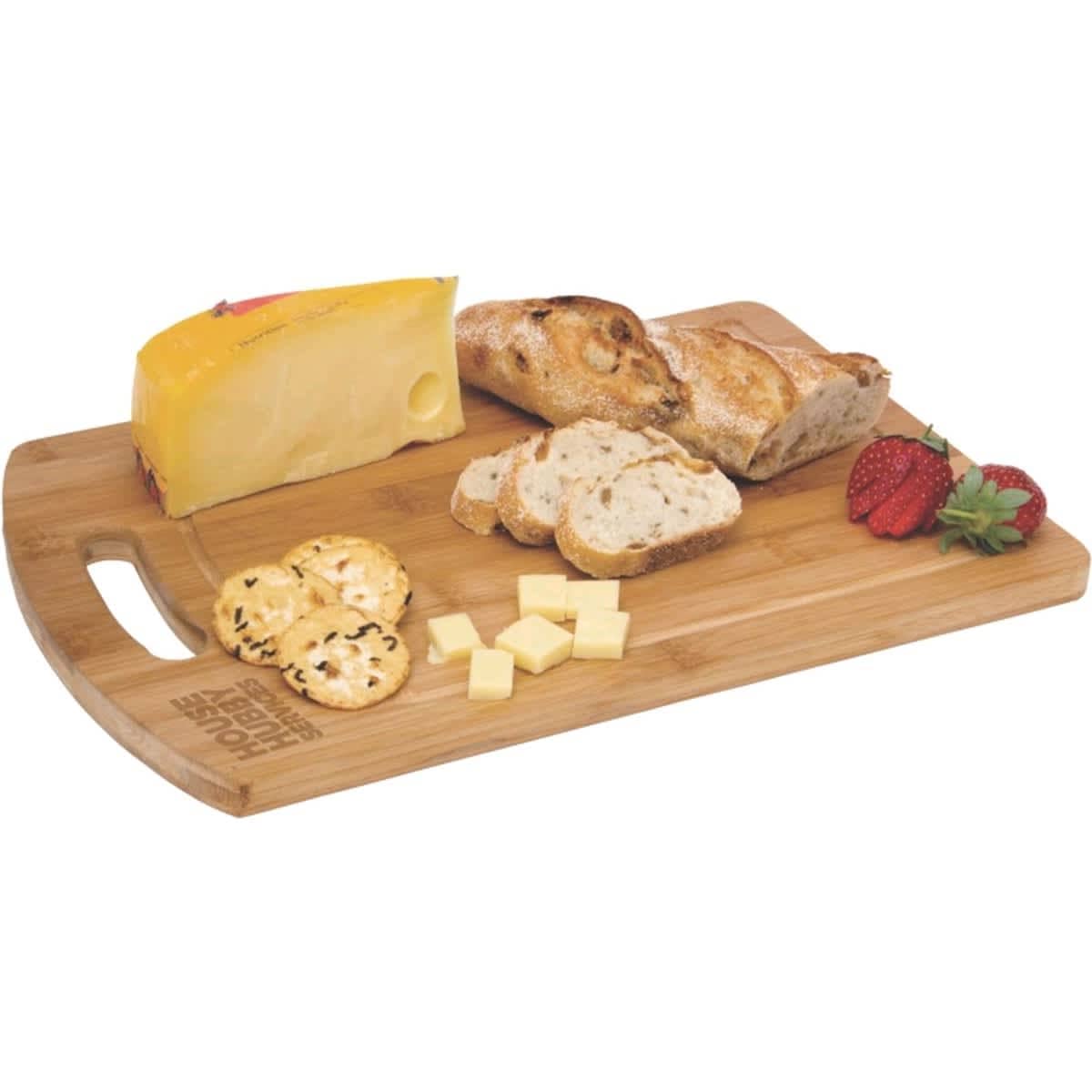 A bamboo cheese board featuring a block of cheese, sliced bread, crackers, and strawberries. It has a logo.